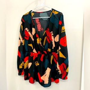 Black/multi color peplum top.